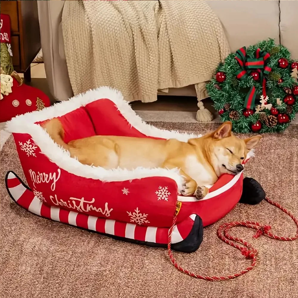 Dog lying on a red Christmas-themed dog bed with a wreath in the background.
